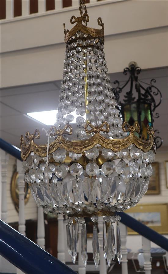 A gilt metal cut glass bag-shaped ceiling light and a pair of matching wall lights